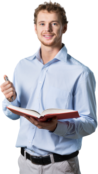A man in a blue button up shirt holding a pen in one hand and a book in the other